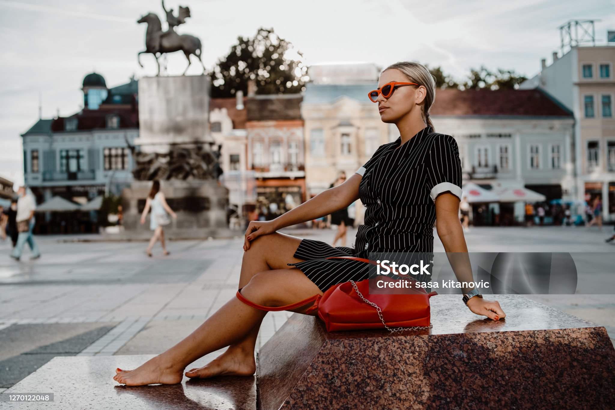 https://media.istockphoto.com/id/1270122048/photo/young-blonde-woman-taking-a-rest-in-the-town-square.jpg?s=2048x2048&amp;w=is&amp;k=20&amp;c=STwNK-STH21HyeImBO4LhshP8S-DYwjRq7Wp0DRPav4=