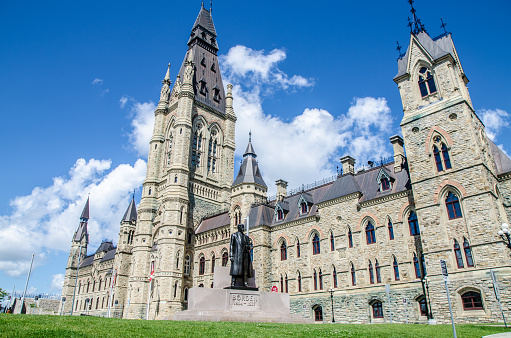 West building of Parliament of Canada during summer day.
In foreground, statue of Prime Minister Robert Laird Borden

Note to Inspector:
Ref: https://www.tpsgc-pwgsc.gc.ca/citeparlementaire-parliamentaryprecinct/decouvrez-discover/statues-eng.html

This statue belongs to the Government of Canada and is therefore of the public domain.

Of the 29 entries submitted to the contest for this statue, the winner was Toronto-based sculptor Frances Loring. The monument was unveiled at the opening of a new session of Parliament in 1957.