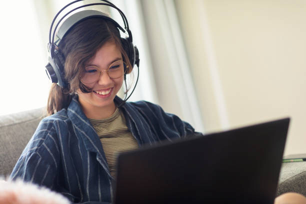istock Girl having fun playing video games 1270126886