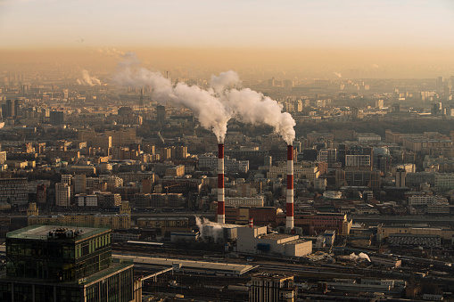 The thermal power plant in a big city in the winter, with piles of steam over pipes. Moscow, Russia, Eastern Europe.