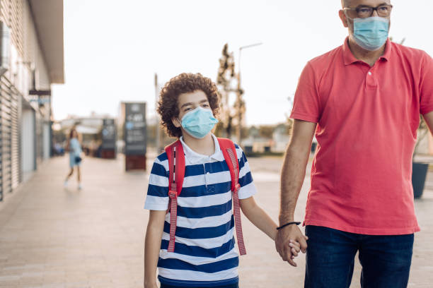 istock Boy going to school with his dad 1270135783