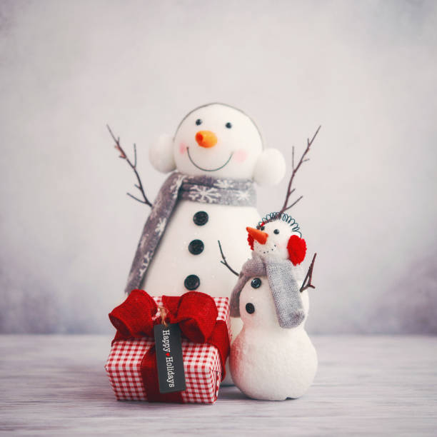 istock Cute Christmas still life image with two snowmen and gift 1270143109