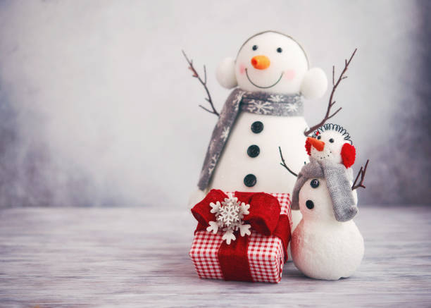 istock Cute Christmas still life image with two snowmen and gift 1270143123