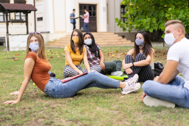 istock High school students taking a break in the school yard after returning to school in coronavirus conditions 1270144229