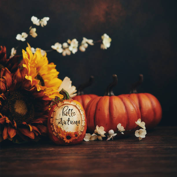 istock Thanksgiving arrangement with sunflowers and pumpkin with Fall greeting 1270144382
