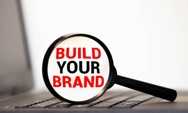 istock magnifier with text Build Your Brand on the white and red background 1270145209