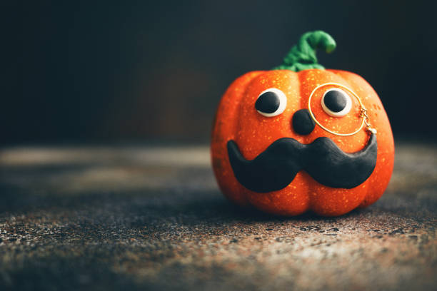 istock Cute handmade pumpkin with handlebar mustache and monocle 1270145216