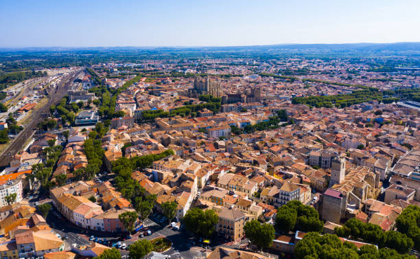 Aerial view of Narbonne, France Picturesque aerial view of Narbonne cityscape overlooking ancient Gothic building of Cathedral of Saints Justus and Pastor, France narbonne stock pictures, royalty-free photos & images