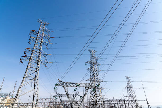 istock High voltage tower transmission tower in the blue sky and white clouds background 1270152956