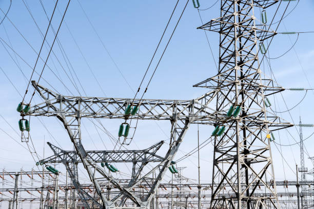 istock High voltage tower transmission tower in the blue sky and white clouds background 1270153013