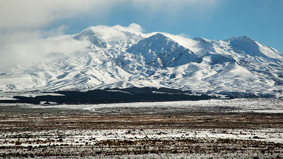 Mount Ruapehu and surrounds in New Zealand covered in snow during winter as seen from the Eastern side on a sunny day