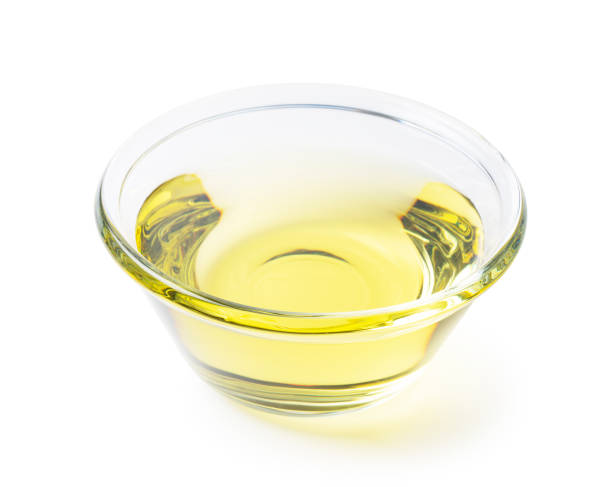 istock Vegetable oil in a glass bowl on a white background 1270155042