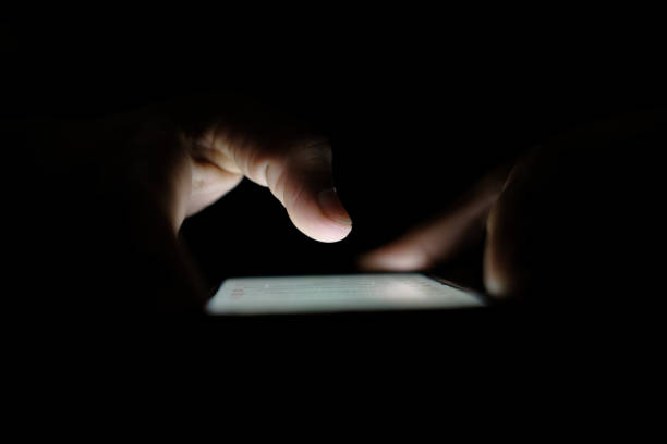 istock Close up of hacker hand stealing data from smart phone 1270157720
