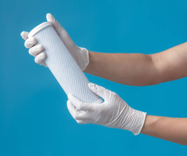 istock Filters for Drinking Water,Hand holding water filter cartridge on blue background 1270157931