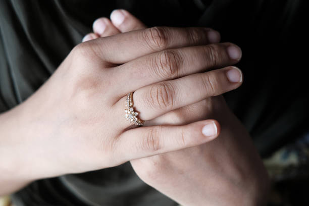 istock Woman hand with engagement ring, close up 1270158110