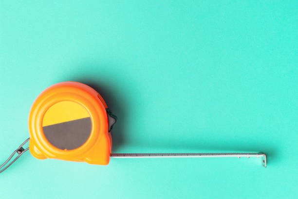Measuring tape on a blue background, a copy of the space