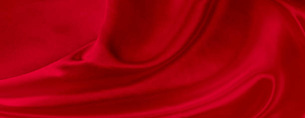 istock Black red satin dark fabric texture luxurious shiny that is abstract silk cloth background with patterns soft waves blur beautiful. 1270166055