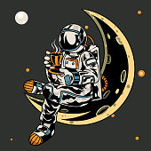 istock Astronaut sitting on the moon while holding a cup of coffee t-shirt and apparel trendy design with simple typography, good for t-shirt graphics, poster, print and other uses. Vector illustration 1270177076