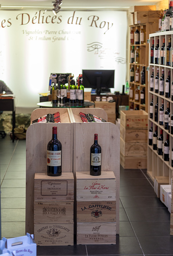 Saint Emilion, France - September 8, 2018: Interior of a wine shop in Saint Emilion in France. St Emilion is one of the principal red wine areas of Bordeaux and very popular tourist destination.