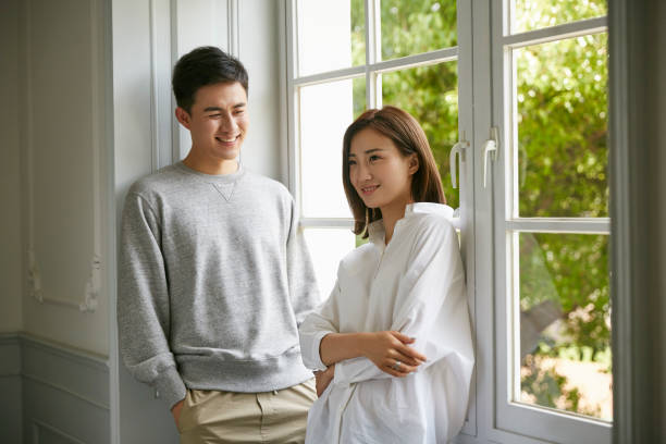 istock young asian couple staying at home 1270179315