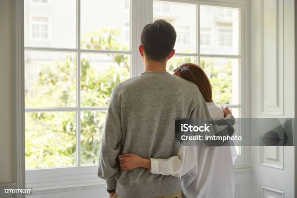 Young Asian Couple Staying At Home Stock Photo - Download Image Now - Couple - Relationship, Rear View, Consoling