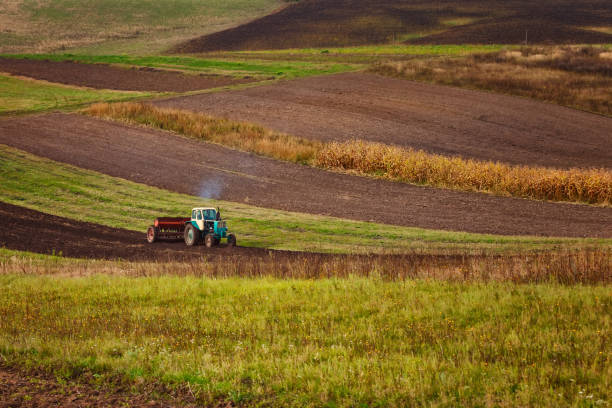 istock modern tractor in the agricultural field 1270186496