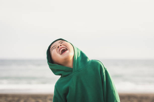 Portrait of boy standing in the spring beach