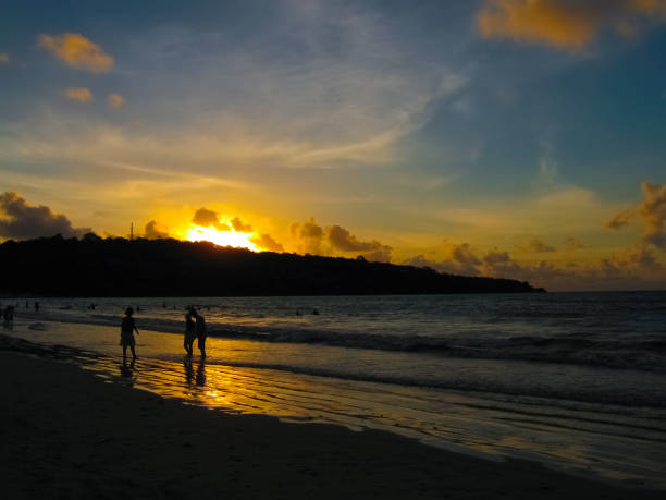 istock image of the sun setting over the ocean 1270189232