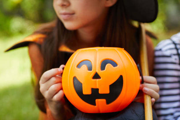 istock Girl with pumpkin 1270193626