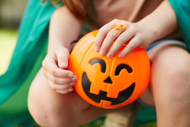 istock Girl with toy pumpkin 1270193639