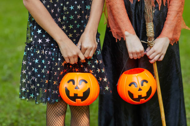 istock Girls with baskets at Halloween 1270193866