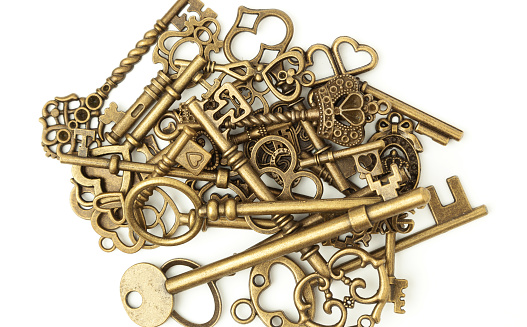 pile of old keys isolated on white background