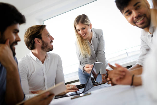 istock Team of architects working on construction plans in office 1270195905
