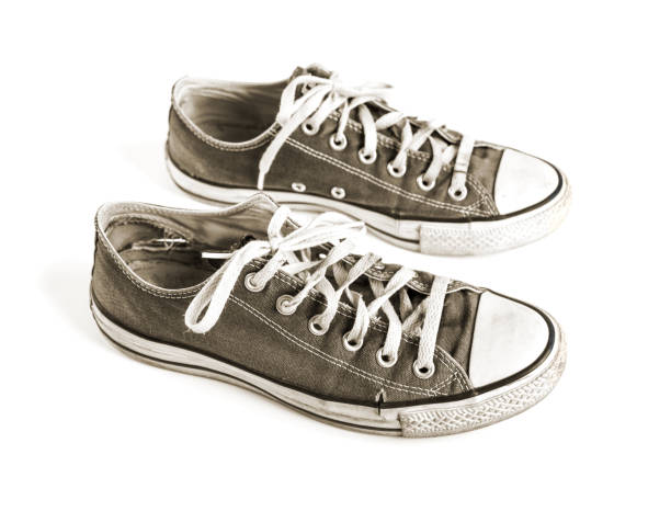 istock Old black sneakers isolated on white background 1270199306