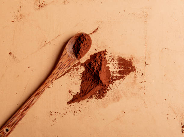 istock Cocoa Powder on brown table with spoon 1270199978