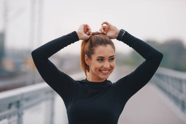 istock Fittnes woman tying her hair 1270200295