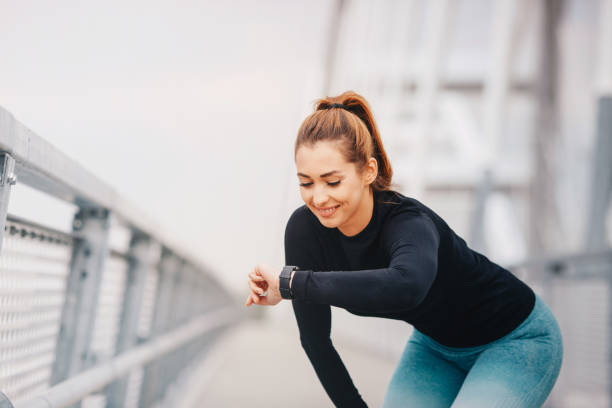 istock Fitness woman taking a break monitoring progress on smartwatch after difficult training. 1270200311