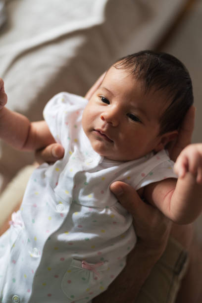 istock Father holding newborn baby 1270205003