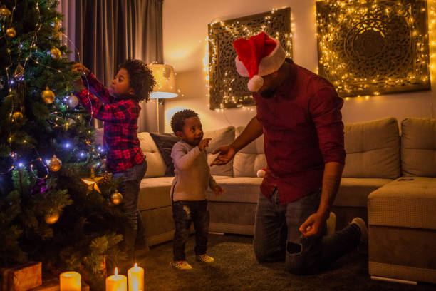 istock Xmas fun for beautiful Black father and sons at Christmas 1270205162