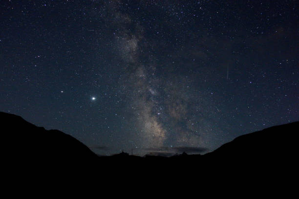 istock Starry sky and milky way in the mountains. 1270209038