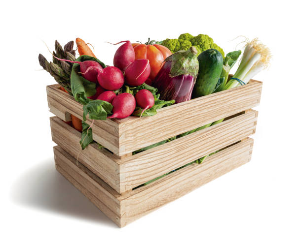 istock Wooden box with vegetables isolated from the white background 1270209578