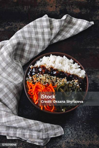 Poké Bowl Of Rice Sea Kale And Carrots Stock Photo - Download Image Now - Bowl, Chopsticks, Color Image