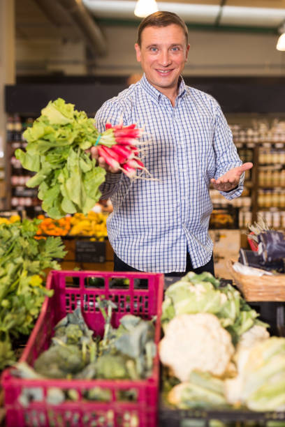 istock Man buying radish for salad 1270210237