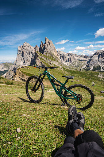 Mountain bike MTB outdoor in the Dolomites: relaxing on the Odle Seceda famous landmark