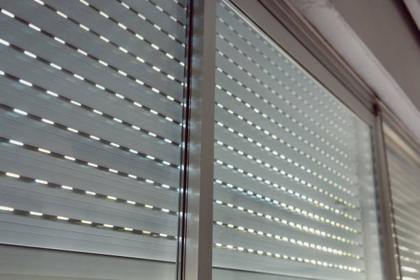 Venetian blinds on glass windows Venetian blinds on glass windows prison lockdown stock pictures, royalty-free photos & images