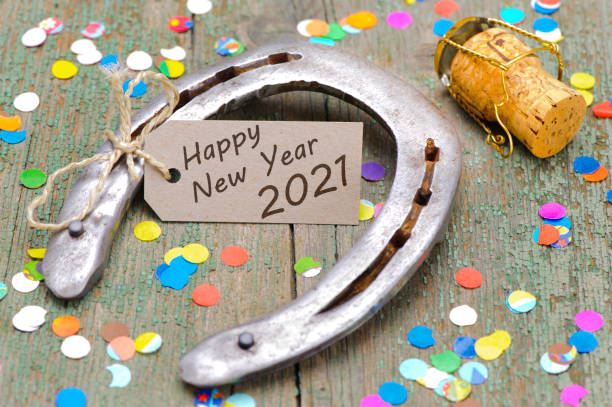 horse shoe with greetings for new year 2021 horse shoe with greetings for new year 2021 good luck charm photos stock pictures, royalty-free photos & images