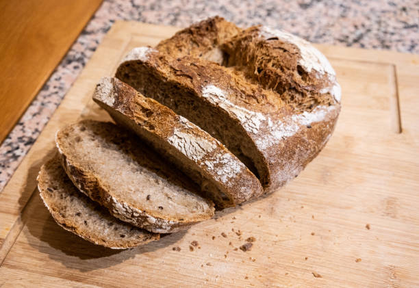 istock Fresh bread on wooden board 1270213268