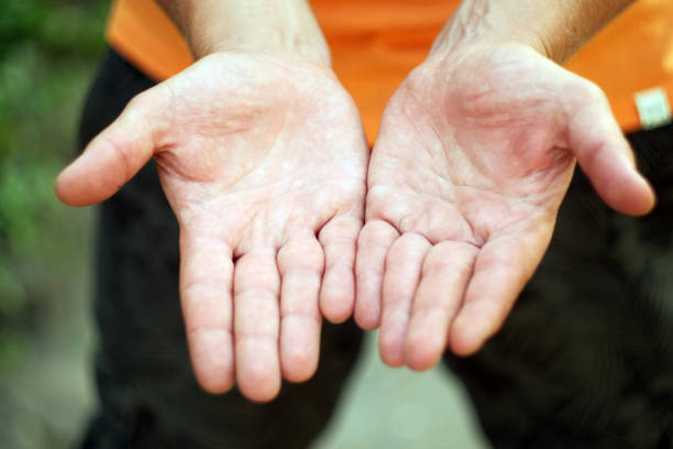 istock Child's hands holding offering giving something or asking begging for something. 1270213422
