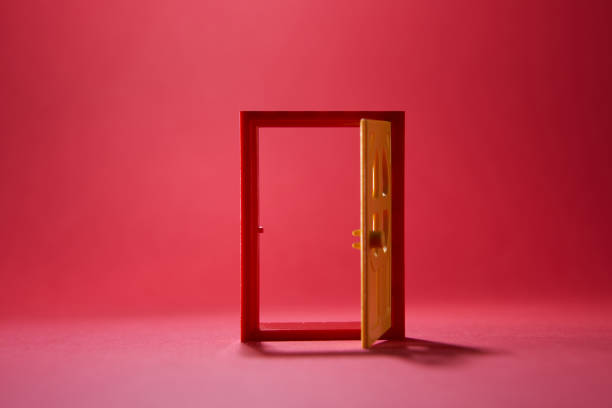 istock red toy door against black background 1270214482