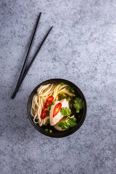 istock Chicken asian soup on vertical gray background 1270214866